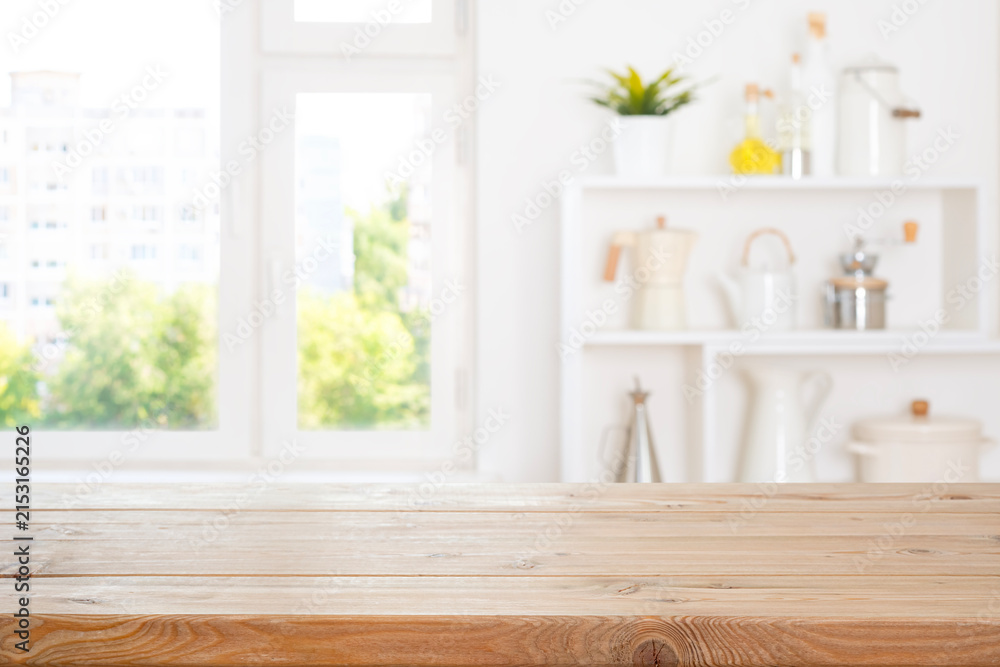Obraz premium Kitchen wooden empty table for product display on bright modern interior with window view background