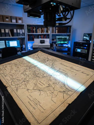 Illuminated Military Operations Map Table in Dark Control Room