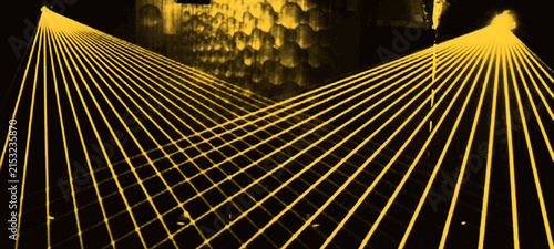 Bild auf Leinwand Bright yellow laser light projection creating intricate cross hatch mesh pattern