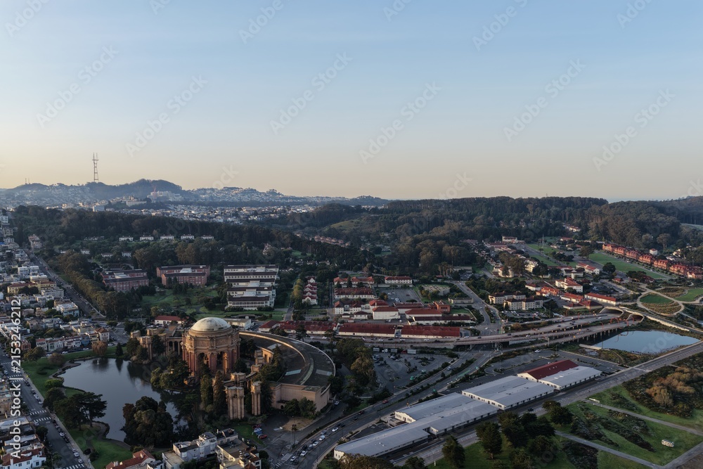 Fototapeta premium Aerial view of San Francisco's Palace of Fine Arts near the Golden Gate Bridge at golden hour. g.