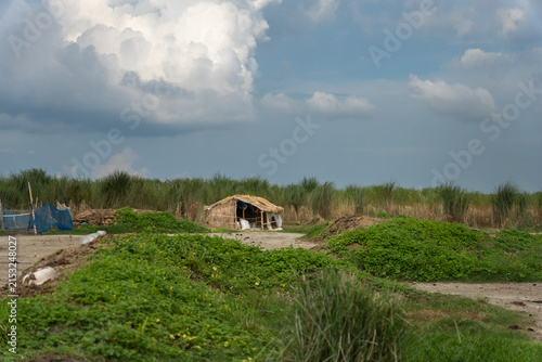 Fotografie Simple Rural Hut on a Sandy River Char in Bangladesh
