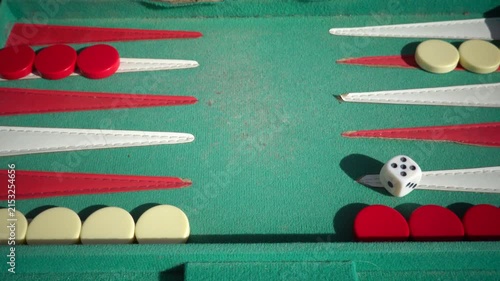 Hirtshals, Denmark Two people playing backgammon while rolling dice. 