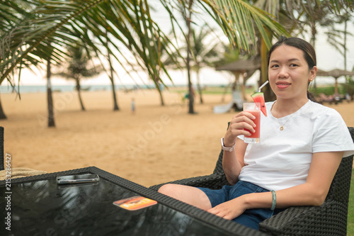 Refreshing drink on a beachside table with palm trees in Sri Lanka