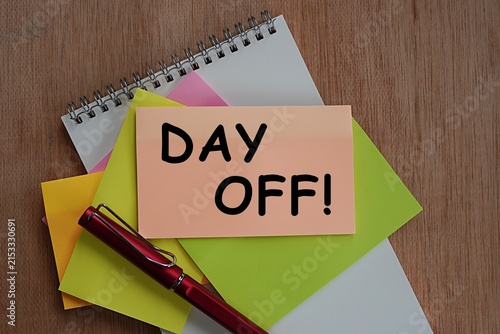 DAY OFF. Massage on colored sticker paper sheets. Concept of vacation outside of work. Take time for yourself. Relax after a hard day at work