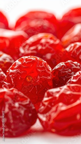 Close-Up of Vibrant Red Dried Cranberries on a White Background Highlighting Texture and Color