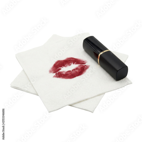 Red lipstick print on white tissue paper with makeup tube, romantic love and beauty symbol