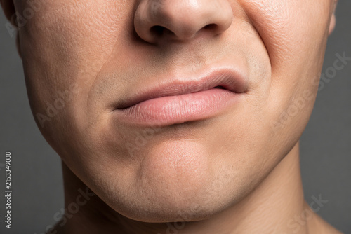 Sneering mouth close-up, emotion and attitude concept