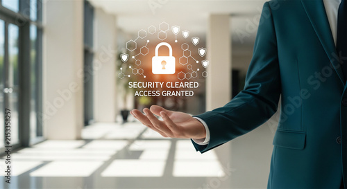 Cyber security access granted hologram, businessman holding virtual padlock icon in office