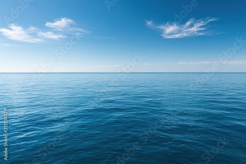 Minimalist seascape featuring clear blue sky and tranquil azure sea
