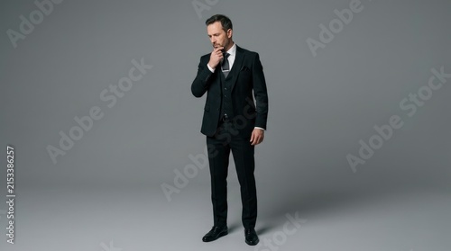 Successful Businessman In Formal Black Suit Thinking