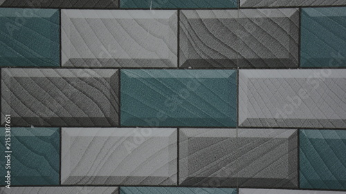 Geometric Teal and Gray Tiled Wall Texture with Repeating Rectangular Pattern