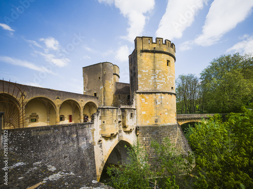 Historic Porte des Allemands in Metz, France, photographed on April 26, 2025. Medieval fortified city gate and bridge featuring massive round towers, stone walls and defensive architecture surrounded 