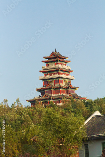 Siping, Jilin, China - September 10, 2023: The 7-tier traditional Chinese Nalan Tower rising above trees and autumn foliage. The pavilion was built to honor the famous Qing Dynasty poet Nalan Xingde.