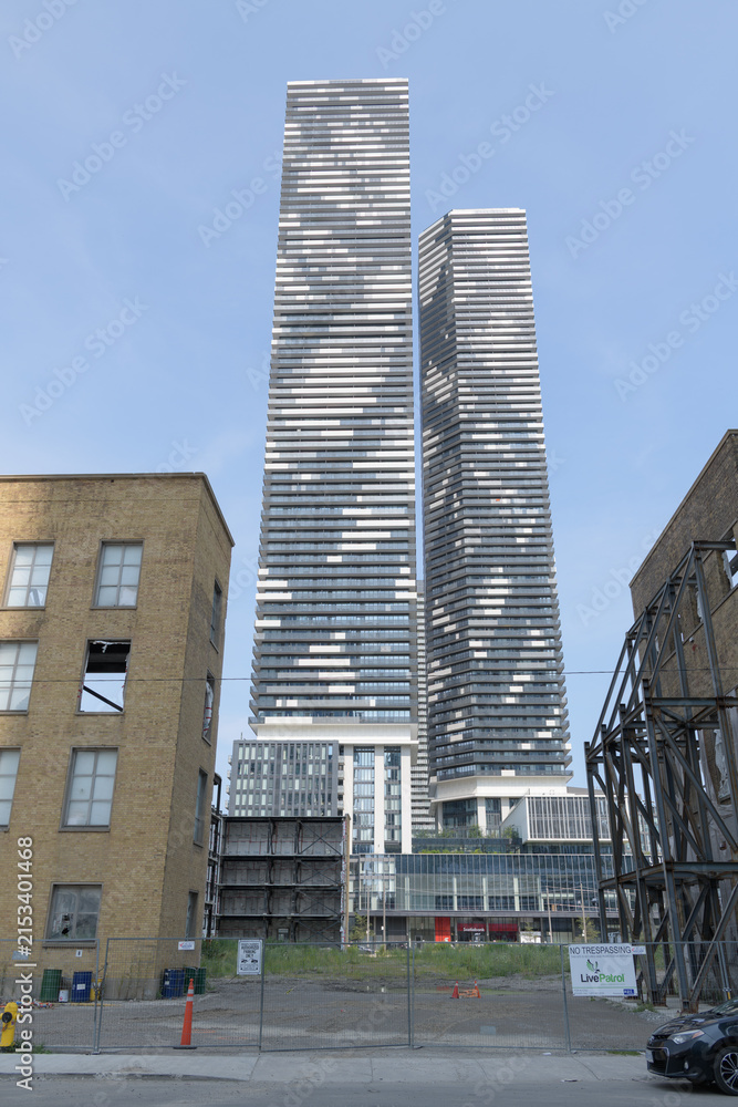 Fototapeta premium former LCBO headquarters/retail complex at 55 Lake Shore Blvd E and residential architecture (Sugar Wharf Condos, 100 Queens Quay E) west elevation, Toronto