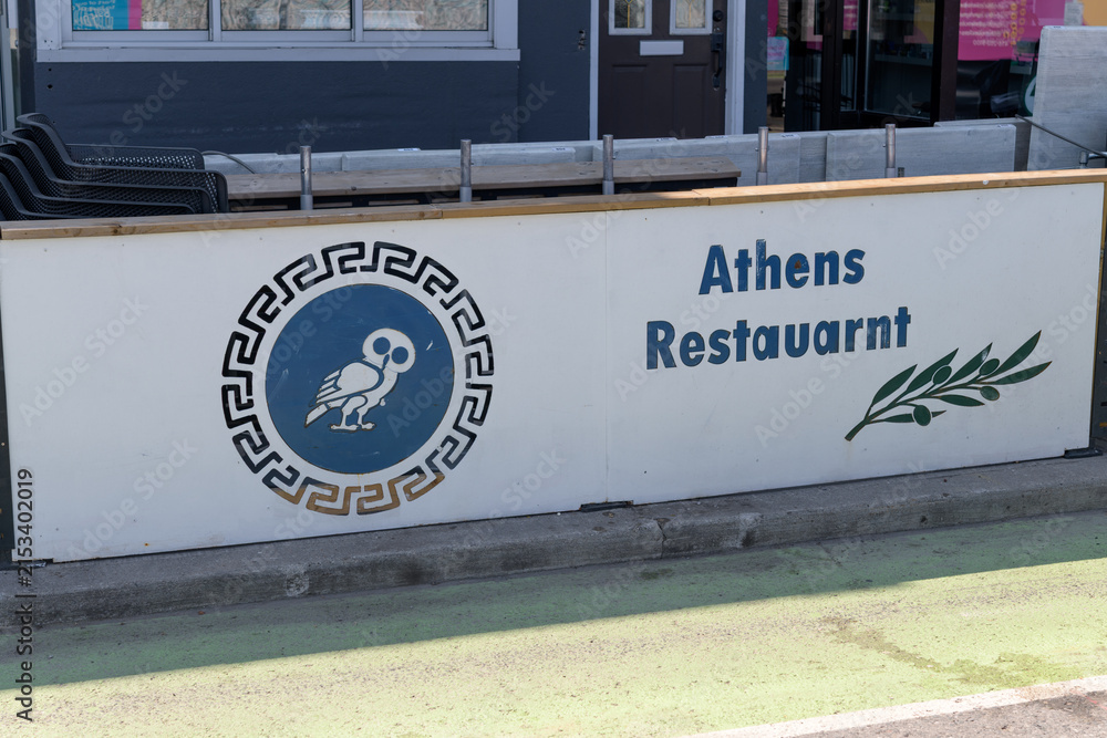 Fototapeta premium street sign outside Athens Restaurant, a Greek restaurant located at 707 Danforth Av, Toronto
