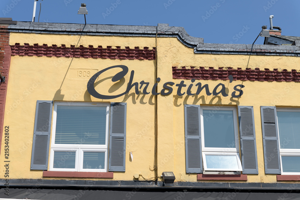 Fototapeta premium exterior building facade and sign of Christinas on the Danforth, a Greek restaurant, located at 492 Danforth Av, Toronto