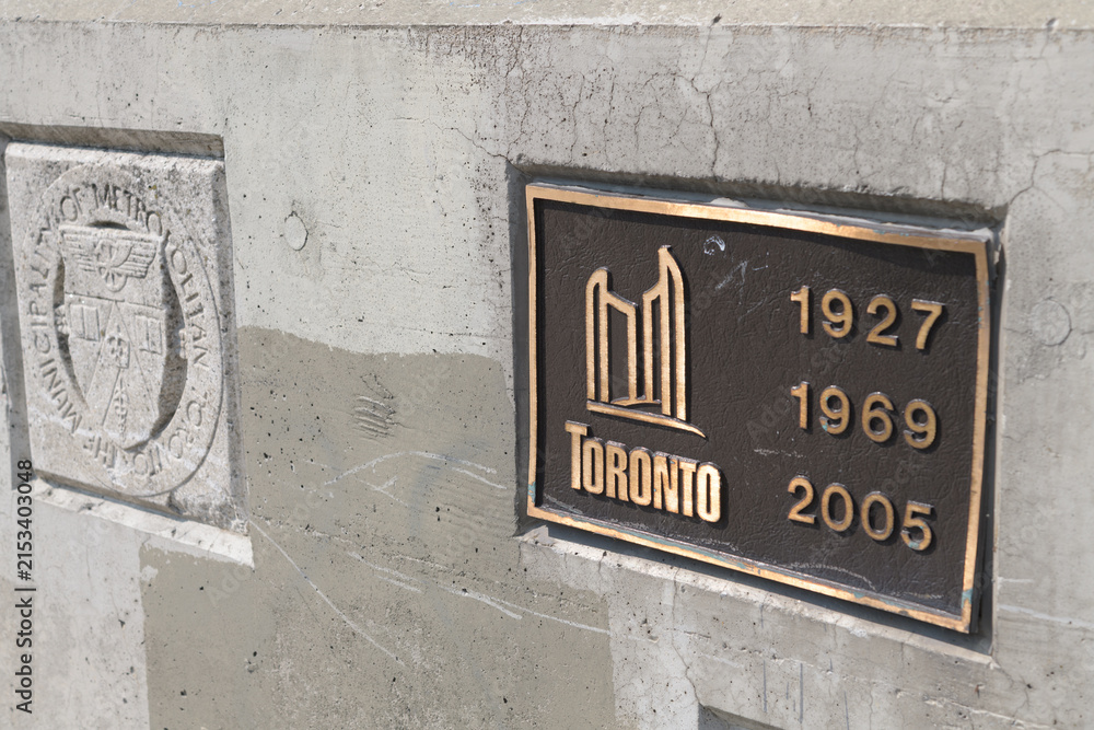 Fototapeta premium old Metropolitan Toronto stone and new bronze metal plaques on the Leaside Bridge
