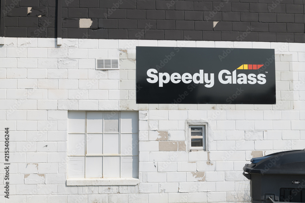 Fototapeta premium sign at Speedy Glass Leaside, an auto glass shop, located at 121 Laird Dr, East York, Toronto