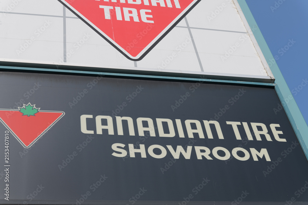 Fototapeta premium close-up of road-side pylon sign of Canadian Tire, a department store, located at 825 Eglinton Av E (East York), Toronto