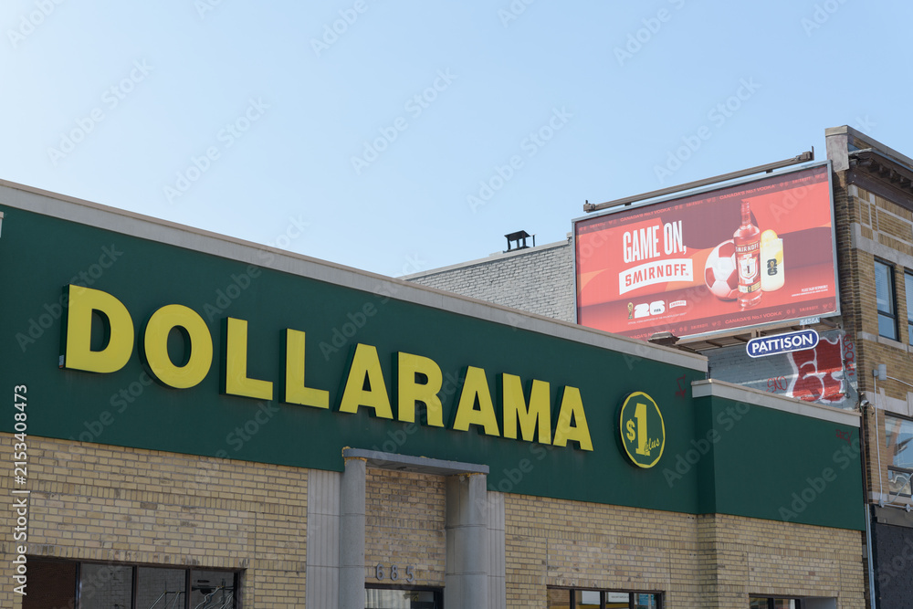 Fototapeta premium exterior building facade and sign of Dollarama, a dollar store chain, located at 685 Danforth Av, Toronto
