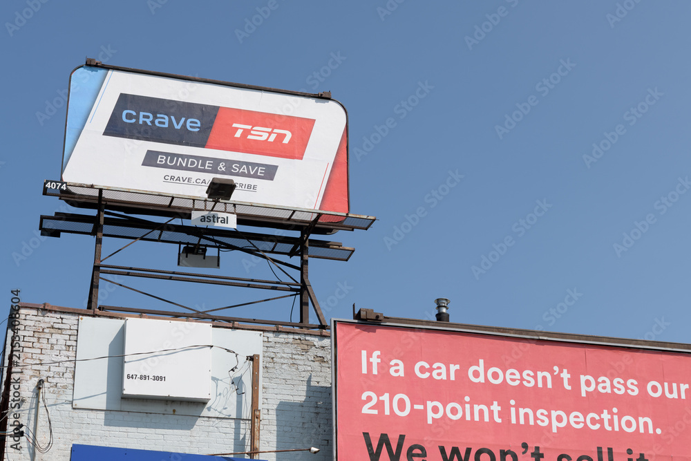 Fototapeta premium rooftop billboard with advertisement for Crave and TSN, Toronto