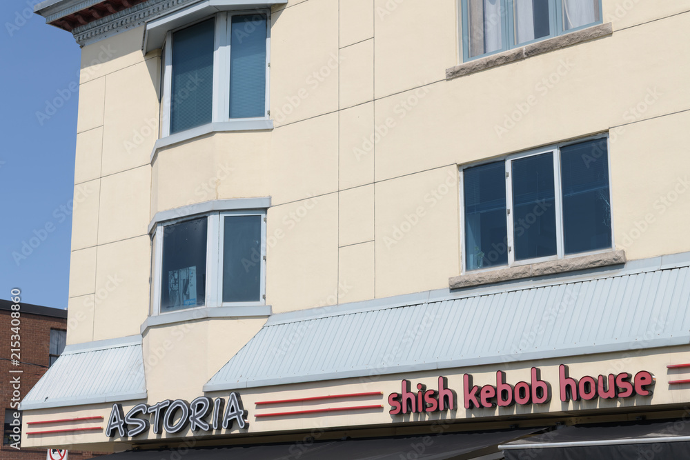 Fototapeta premium commercial block with sign of Astoria Shish Kebob House, a Greek restaurant, located at 390 Danforth Av, Toronto