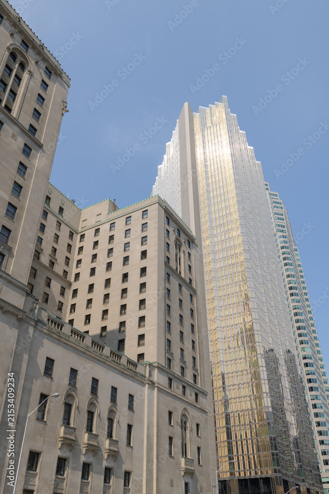 Fototapeta premium Royal Bank Plaza and the Châteauesque Fairmont Royal York at 100 Front St W, Toronto, designed by Ross and Macdonald (with Sproatt and Rolph) for the Canadian Pacific Railway as a grand hotel