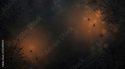 The beautiful reflections of vibrant autumn leaves and the stark silhouettes of bare tree branches appear in a calm puddle on dark