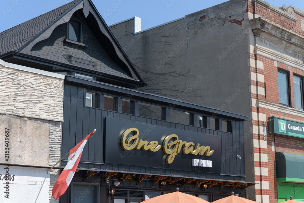 Fototapeta premium exterior building facade and sign of One Gram Coffee Bar, a coffee shop, located at 466 Danforth Av, Toronto
