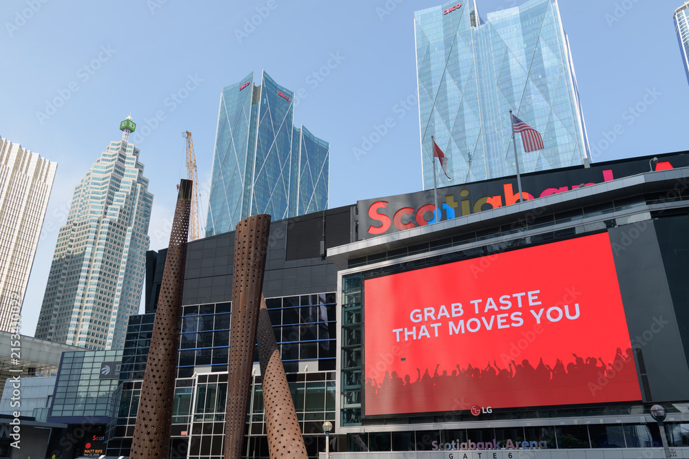 Fototapeta premium looking north from Maple Leaf Square outside Scotiabank Arena with digital billboard featuring an advertisement for Coke Studio, Toronto