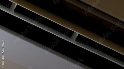 A residential air conditioning unit mounted on a wall, suitable for interior decoration or architectural photography