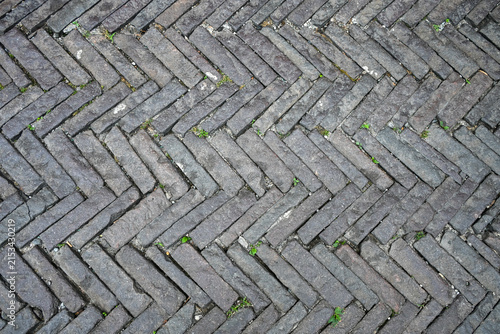 Weathered stone paving arranged in geometric pattern