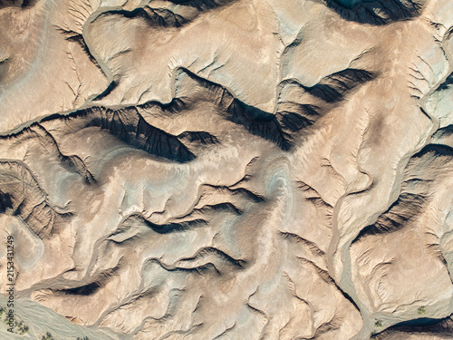 Aerial Abstract Texture of Desert Erosion Patterns and Geological Layers