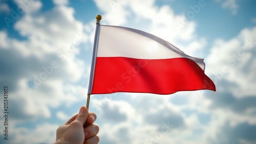 Polish National Flag Waving in the Wind against Sunny Sky