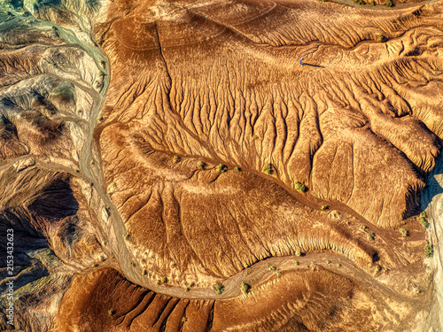 Obraz na plátně Aerial Abstract Texture of Desert Erosion Patterns and Geological Layers
