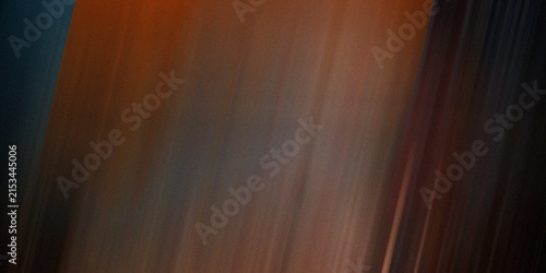 Diagonal brown and orange motion blur texture with subtle grainy filter and dark edges.