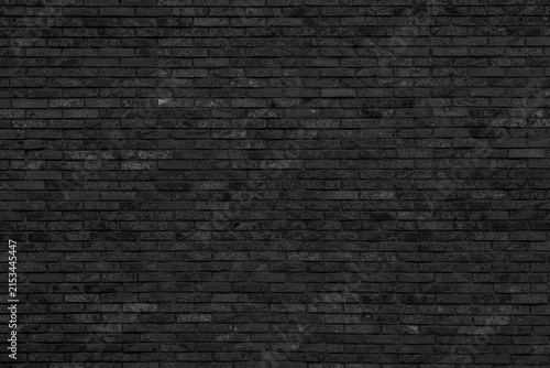 Cuadro en lienzo Black narrow clinker brick wall background with fine textured brickwork surface