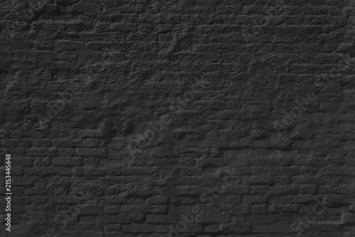 Canvas Print Black brick wall texture with rough uneven surface and dark monochrome tone
