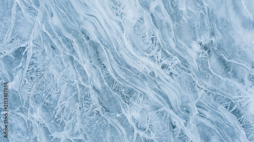 Abstract icy texture with intricate frost patterns and fluid icy formations on a frozen surface