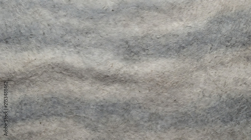 Close-up view of textured gray concrete surface with subtle variations and patterns creating an abstract background