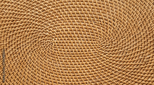 Intricate woven straw pattern showcasing skilled craftsmanship in natural fiber artistry for decorative or functional use