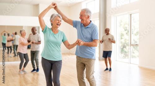 Senior couple enjoying dance class together as active retirement and healthy aging lifestyle