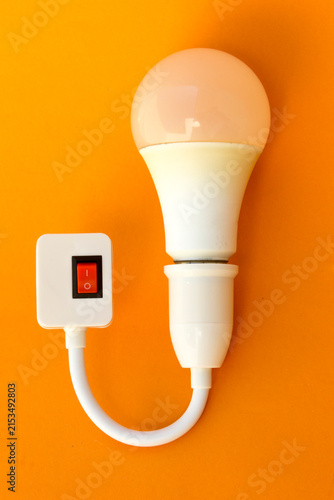 LED Light Bulb with On Off Switch Adapter on Orange Background
