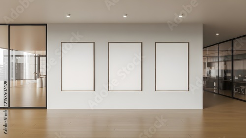 Modern office interior with three blank vertical poster frames on a white wall, wooden floor, and glass partitions, 3d rendering for business mockup