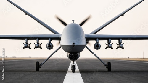 Front view of armed unmanned combat aerial vehicle positioned on a runway