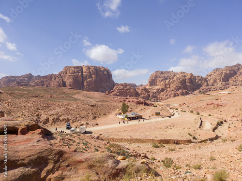 Bild auf Leinwand Sunlight illuminating the towering rose-red sandstone cliffs of The Siq, the nar