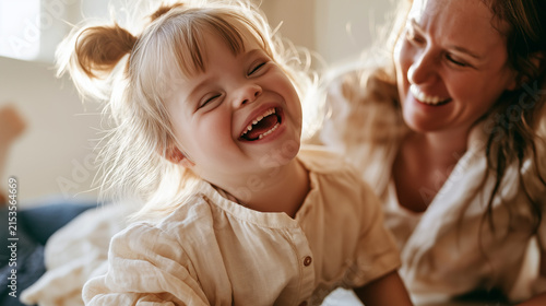 A adorable girl with down syndrome grins happily while playing with her mother at home.