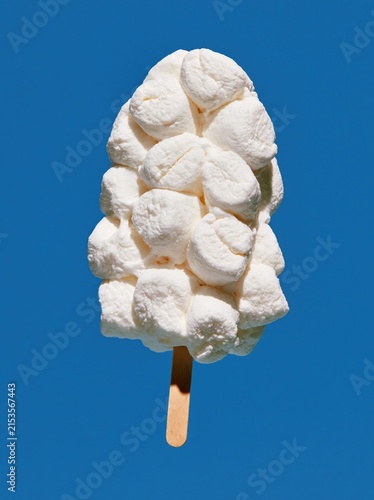 Marshmallow Ice Pop with Small Stacked Pieces on Ultramarine Blue Background