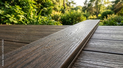 Composite decking board texture on a backyard wooden patio deck.