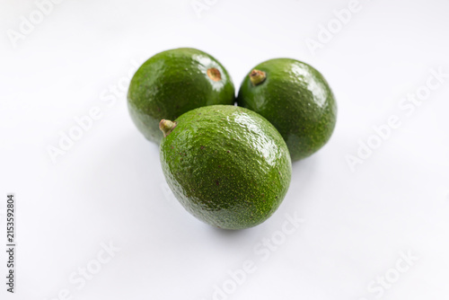 Fresh avocado on white background. Vegetarian food concept.